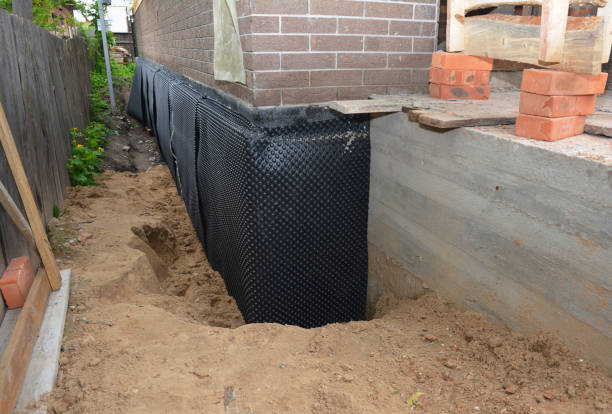 Happy homeowners after waterproofing job in Sayville
